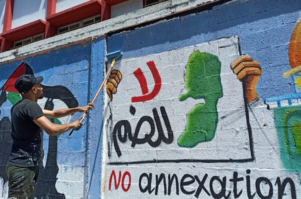 Filistinli gençler, İsrail’in ilhakını grafiti çizerek protesto etti